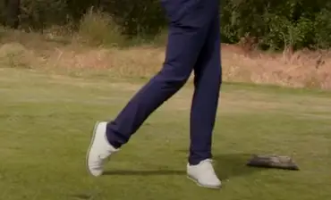 forces on feet during a backswing in golf